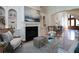 Spacious living room with hardwood floors and fireplace at 858 Middle Fork Trl, Suwanee, GA 30024