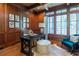 Home office with wood walls and a large window at 858 Middle Fork Trl, Suwanee, GA 30024