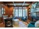 Study with wood paneled walls and built-in shelving at 858 Middle Fork Trl, Suwanee, GA 30024