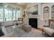 Bright living room with a fireplace and built-in shelving at 858 Middle Fork Trl, Suwanee, GA 30024