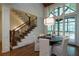 Elegant dining room with a round table and access to a screened porch at 858 Middle Fork Trl, Suwanee, GA 30024