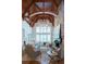Bright living room with high ceilings, large windows, and hardwood floors at 858 Middle Fork Trl, Suwanee, GA 30024