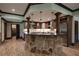 Basement kitchenette with stone countertops and stainless steel appliances at 858 Middle Fork Trl, Suwanee, GA 30024
