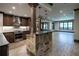 Basement kitchen with stone island and stainless steel appliances at 858 Middle Fork Trl, Suwanee, GA 30024