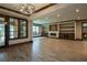 Finished basement with hardwood floors and built-in shelving at 858 Middle Fork Trl, Suwanee, GA 30024