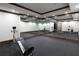 Spacious home gym with mirrored walls and high-end equipment at 858 Middle Fork Trl, Suwanee, GA 30024