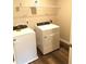 Functional laundry room with washer and dryer at 689 S Jeff Davis Dr, Fayetteville, GA 30215