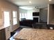 Kitchen features granite countertops and a view into the living room with a fireplace at 689 S Jeff Davis Dr, Fayetteville, GA 30215