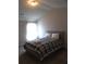 Bright bedroom featuring a comfy double bed and large window at 689 S Jeff Davis Dr, Fayetteville, GA 30215