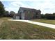 Two-story brick home with a detached garage and expansive backyard at 689 S Jeff Davis Dr, Fayetteville, GA 30215