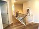 Upstairs hallway with hardwood floors and access to bedrooms at 689 S Jeff Davis Dr, Fayetteville, GA 30215