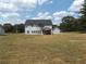 Two-story house with a large backyard and covered patio at 689 S Jeff Davis Dr, Fayetteville, GA 30215