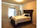 Spacious bedroom with carpeted floors and a large bed at 689 S Jeff Davis Dr, Fayetteville, GA 30215