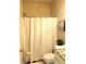 Clean bathroom with a shower/tub combo and granite countertop at 689 S Jeff Davis Dr, Fayetteville, GA 30215