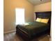 Bedroom with carpeted floors and a large bed at 689 S Jeff Davis Dr, Fayetteville, GA 30215