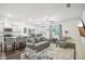 Open living room with kitchen, island, and gray sofas at 174 Hampton Cir, Mcdonough, GA 30253
