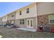 Row of townhouses with individual back patios and small yards at 174 Hampton Cir, Mcdonough, GA 30253