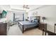 Spacious Primary bedroom with a king-size bed and TV at 174 Hampton Cir, Mcdonough, GA 30253