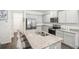 Modern kitchen featuring granite countertops and gray cabinets at 174 Hampton Cir, Mcdonough, GA 30253