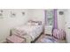 Charming bedroom with white furniture and purple accents at 174 Hampton Cir, Mcdonough, GA 30253