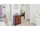 Upstairs hallway with bedroom access and a small cabinet at 174 Hampton Cir, Mcdonough, GA 30253