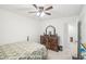 Spacious bedroom with carpeted floor, ceiling fan, and a dresser at 174 Hampton Cir, Mcdonough, GA 30253