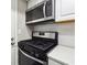 Stainless steel appliances including microwave and range in this updated kitchen at 6851 Roswell Rd # E1, Atlanta, GA 30328