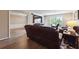 Open living room with hardwood floors and access to other rooms at 6851 Roswell Rd # E1, Atlanta, GA 30328