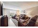 Spacious living room featuring comfortable leather recliners and a large TV at 6851 Roswell Rd # E1, Atlanta, GA 30328