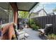 Cozy brick patio with seating area and lush greenery at 6851 Roswell Rd # E1, Atlanta, GA 30328