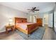 Main bedroom with ceiling fan, large bed, dresser, and walk-in closet at 6851 Roswell Rd # E1, Atlanta, GA 30328