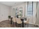 Bright dining room features hardwood floors and a modern dining table with six chairs at 2274 Jamin Bnd # 14, Lithonia, GA 30058