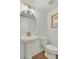 Elegant powder room with pedestal sink and modern fixtures at 1094 Battery Park Rd, Decatur, GA 30033