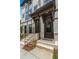 Front entrance of a townhome with brick accents and steps at 1094 Battery Park Rd, Decatur, GA 30033