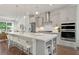Modern kitchen with stainless steel appliances and large island with seating at 1094 Battery Park Rd, Decatur, GA 30033