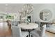 Open concept kitchen and dining area with an island and modern light fixtures at 1094 Battery Park Rd, Decatur, GA 30033