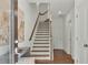 Bright and spacious entryway with staircase and wood floors at 1094 Battery Park Rd, Decatur, GA 30033