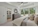 Main bedroom with large windows and en-suite bathroom access at 1094 Battery Park Rd, Decatur, GA 30033