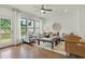 Open living room with hardwood floors and access to a deck at 1094 Battery Park Rd, Decatur, GA 30033