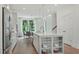 Open concept kitchen with large island and stainless steel appliances at 1094 Battery Park Rd, Decatur, GA 30033