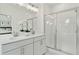 Double vanity bathroom with a large walk-in shower and modern fixtures at 1094 Battery Park Rd, Decatur, GA 30033