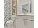 Clean bathroom with a white vanity and geometric shower curtain at 1094 Battery Park Rd, Decatur, GA 30033