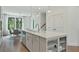 Bright kitchen featuring a large island with seating and white cabinetry at 1096 Battery Park Rd, Decatur, GA 30033