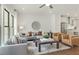 Open living room with hardwood floors, neutral decor, and view into kitchen at 1096 Battery Park Rd, Decatur, GA 30033