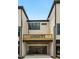 Rear exterior view showcasing a two-story townhome with a deck and garage at 1096 Battery Park Rd, Decatur, GA 30033
