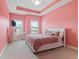 Bright bedroom with pink walls and a comfortable bed at 4079 Dinmont Chase, South Fulton, GA 30349