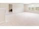 Large bonus room with neutral walls and plush carpeting at 4079 Dinmont Chase, South Fulton, GA 30349