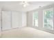 Spacious bedroom featuring ample closet space and large windows at 2049 Town Square Dr, Mcdonough, GA 30253