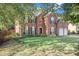 Two story brick house with a two car garage and large yard at 2049 Town Square Dr, Mcdonough, GA 30253