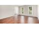 Bright living room featuring hardwood floors and large windows at 2049 Town Square Dr, Mcdonough, GA 30253
